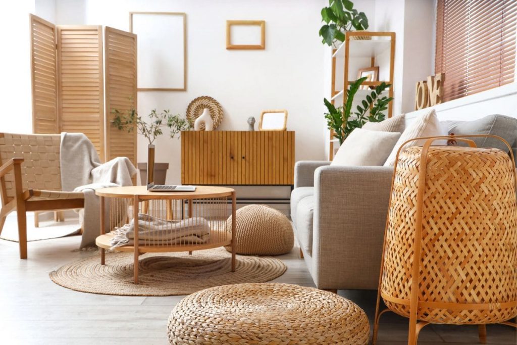 A living room with cozy, trendy furniture, a couch, coffee table, chair, and cabinet.