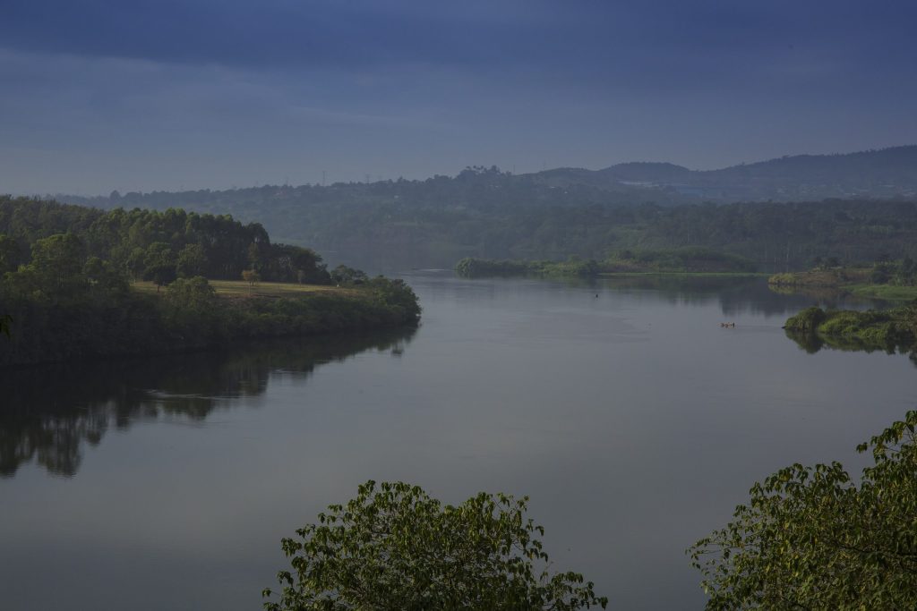 Sunscreen for Lakes and Dams: Could a Thin Floating Layer of Nanomaterial Shield Water from Evaporation?