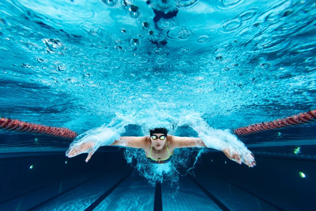 Add Some Vigor To Your Portfolio With VIG (NYSEARCA:VIG) Underwater view on female swimmer in colorful swimsuit swimming butterfly on swimming pool