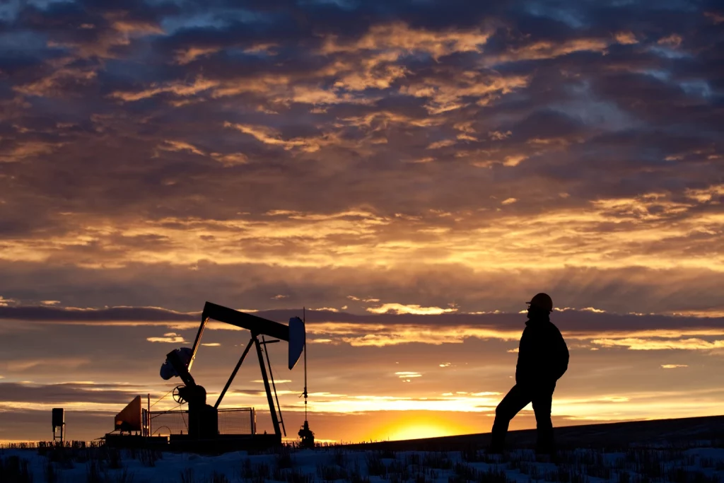 Cenovus Energy: Buying Scale, Boosting Returns, And Still Undervalued (NYSE:CVE) Oilfield Worker or Geologist at Sunrise by Pumpjack