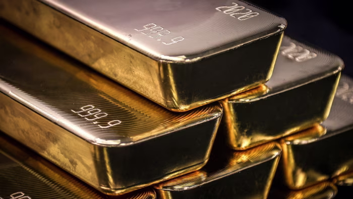 US trade deficit shrinks to smallest since 2020 as gold exports jump Stacked gold bullion bars with ‘999.9’ purity and ‘2020’ stamped on their surfaces.