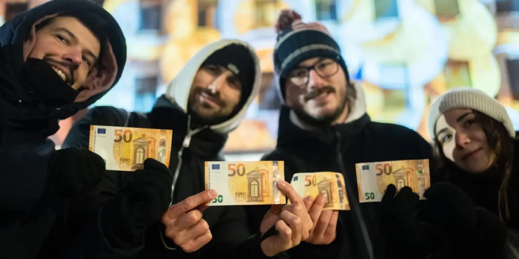 Cash machines in former communist country issue euros for first time after joining currency union Cash machines in former communist country issue euros for first time after joining currency union