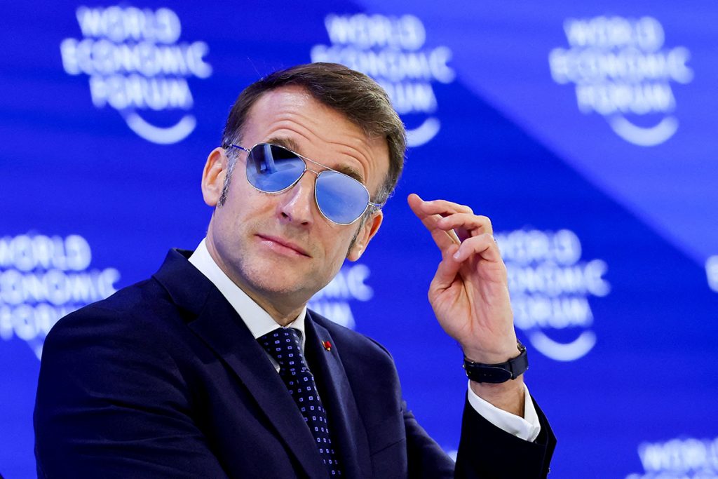 French President Macron wearing sunglasses indoors at Davos