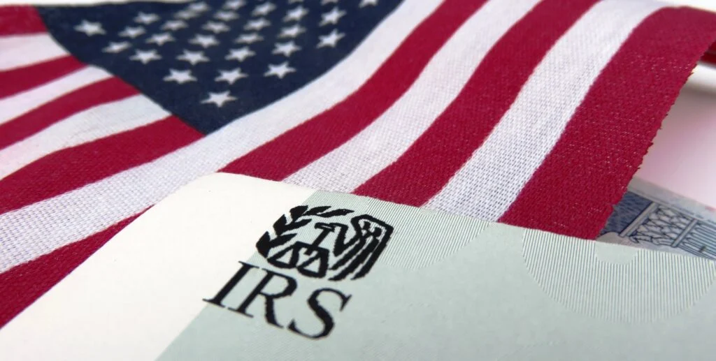 The Risks, Myths, and IRS Concerns Real Estate Investors Worry About irs with american flag